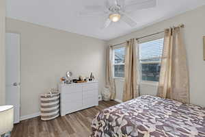 Bedroom featuring ceiling fan and light hardwood / wood-style flooring