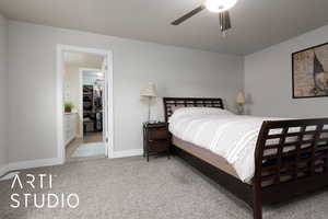 Bedroom featuring light carpet and ceiling fan