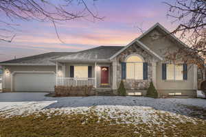 View of front of property featuring a garage