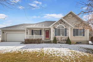 View of front of property featuring a garage