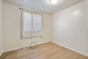 Spare room with light hardwood / wood-style floors