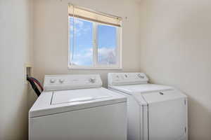 Washroom featuring washing machine and clothes dryer