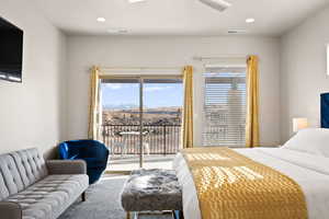 Bedroom featuring access to exterior and a mountain view