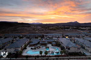 Aerial view at dusk featuring a mountain view