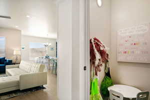 Bathroom featuring a notable chandelier