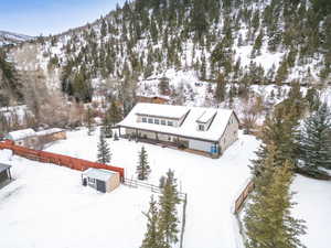 Snowy aerial view with a mountain view