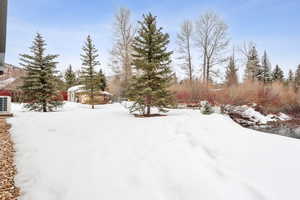 View of yard covered in snow