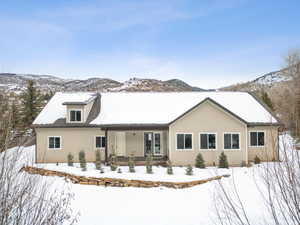 View of front of home with a porch and a mountain view