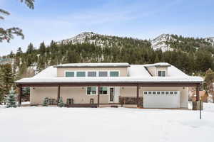 View of front of house featuring a garage and a mountain view