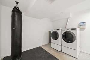 Washroom featuring washer and clothes dryer