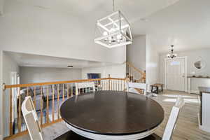 Dining area featuring a chandelier and light hardwood / wood-style floors