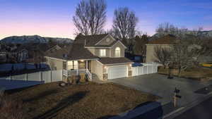 View of front of house featuring a mountain view and a garage