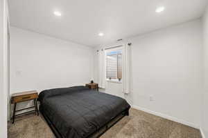 Bedroom featuring carpet flooring