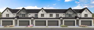 View of property with an attached garage