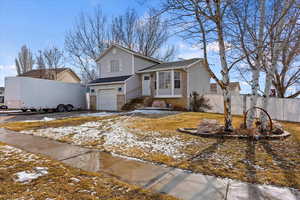 View of front of home featuring a garage