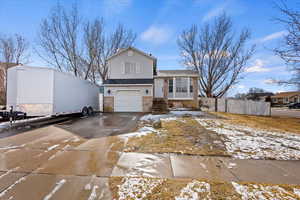 Split level home featuring a garage