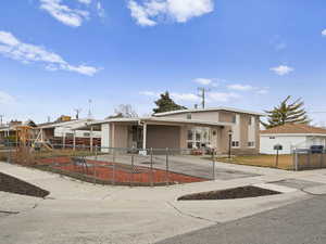 View of front of house with a carport