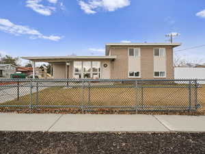 View of front of property with a front yard