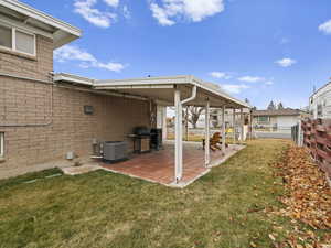 View of yard featuring a patio area and central AC