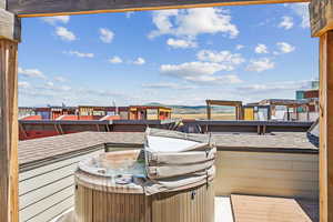 View of patio featuring a hot tub