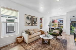 Living room with hardwood / wood-style floors