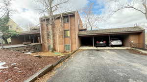 View of home's exterior featuring a carport