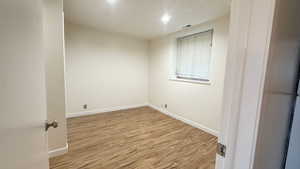 Empty room featuring light hardwood / wood-style floors