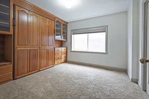 Unfurnished bedroom featuring carpet floors