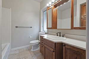 Bathroom featuring toilet and vanity