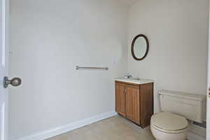 Bathroom with toilet and vanity