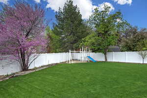 View of yard featuring a playground