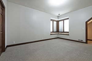 View of carpeted spare room