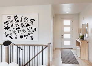 Entryway with light hardwood / wood-style floors