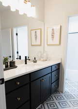 Bathroom with tile patterned flooring and vanity