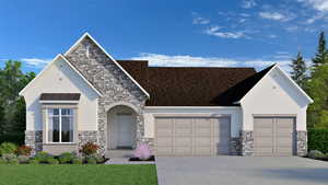 View of front facade featuring a garage
