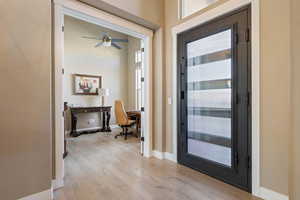 Entrance foyer featuring ceiling fan and light hardwood / wood-style flooring