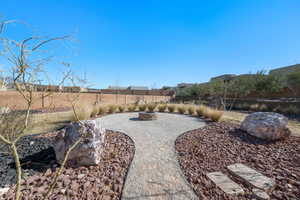 View of yard featuring a fire pit