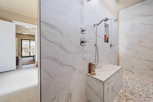 Bathroom with a tile shower