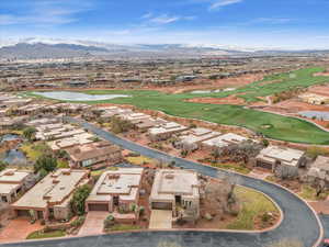 Drone / aerial view featuring a water and mountain view