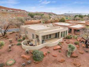 Rear view of house featuring a patio, a mountain view, and central AC unit