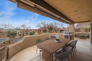 View of patio featuring outdoor dining area and area for grilling