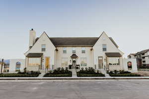 View of front of house featuring a chimney