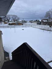 View of yard covered in snow