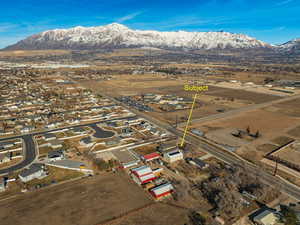 Birds eye view of property featuring a mountain view