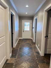 Entryway featuring crown molding