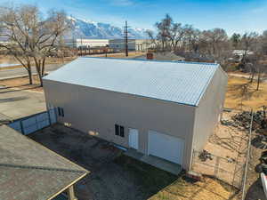 View of side of home with a mountain view