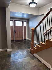 Entrance foyer featuring a textured ceiling