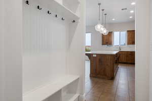 Mudroom featuring light tile patterned floors