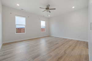 Spare room featuring light wood-type flooring and ceiling fan