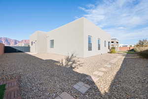 Rear view of property with a mountain view